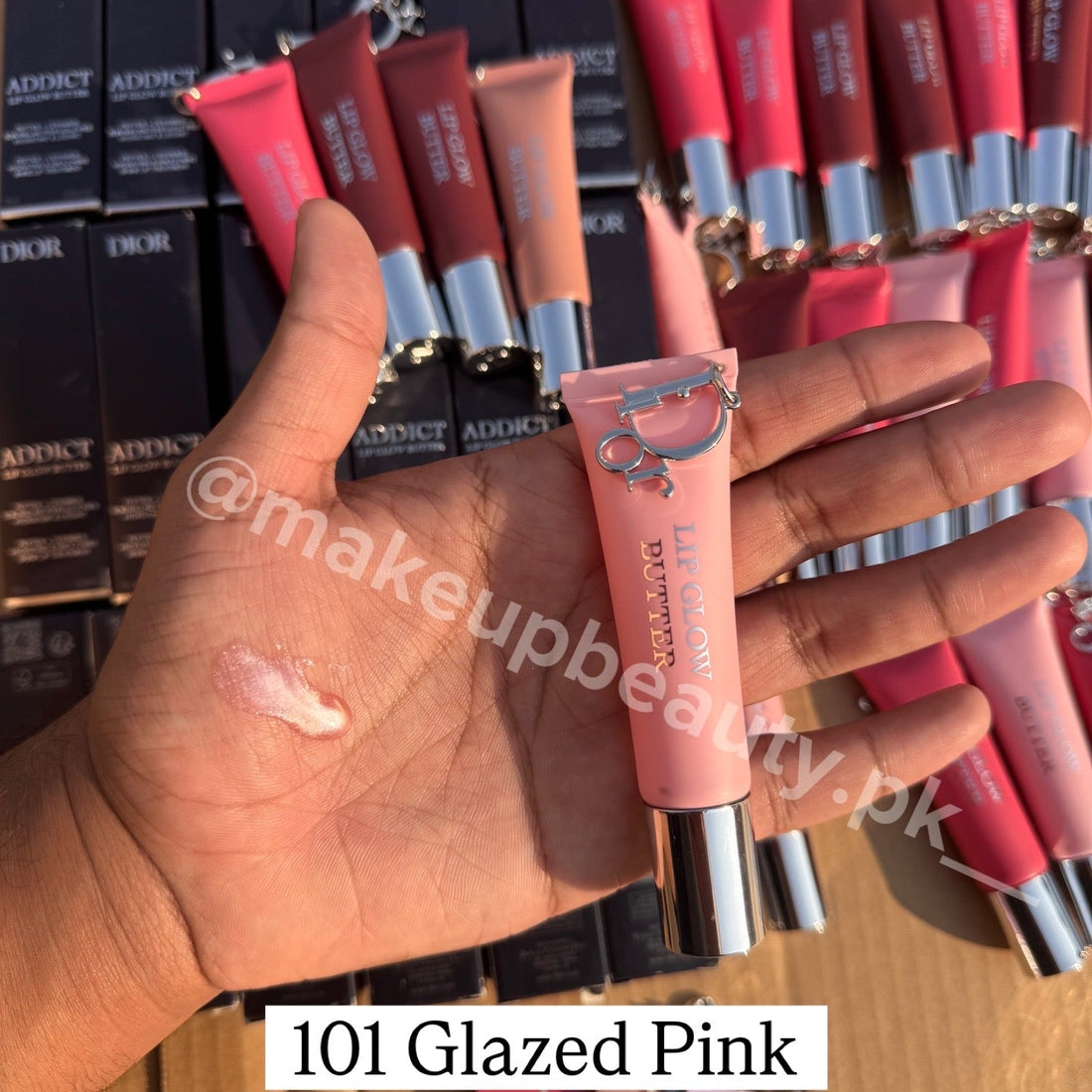 Dior Addict Lip Glow Butter Balm with Dior keychain attached.